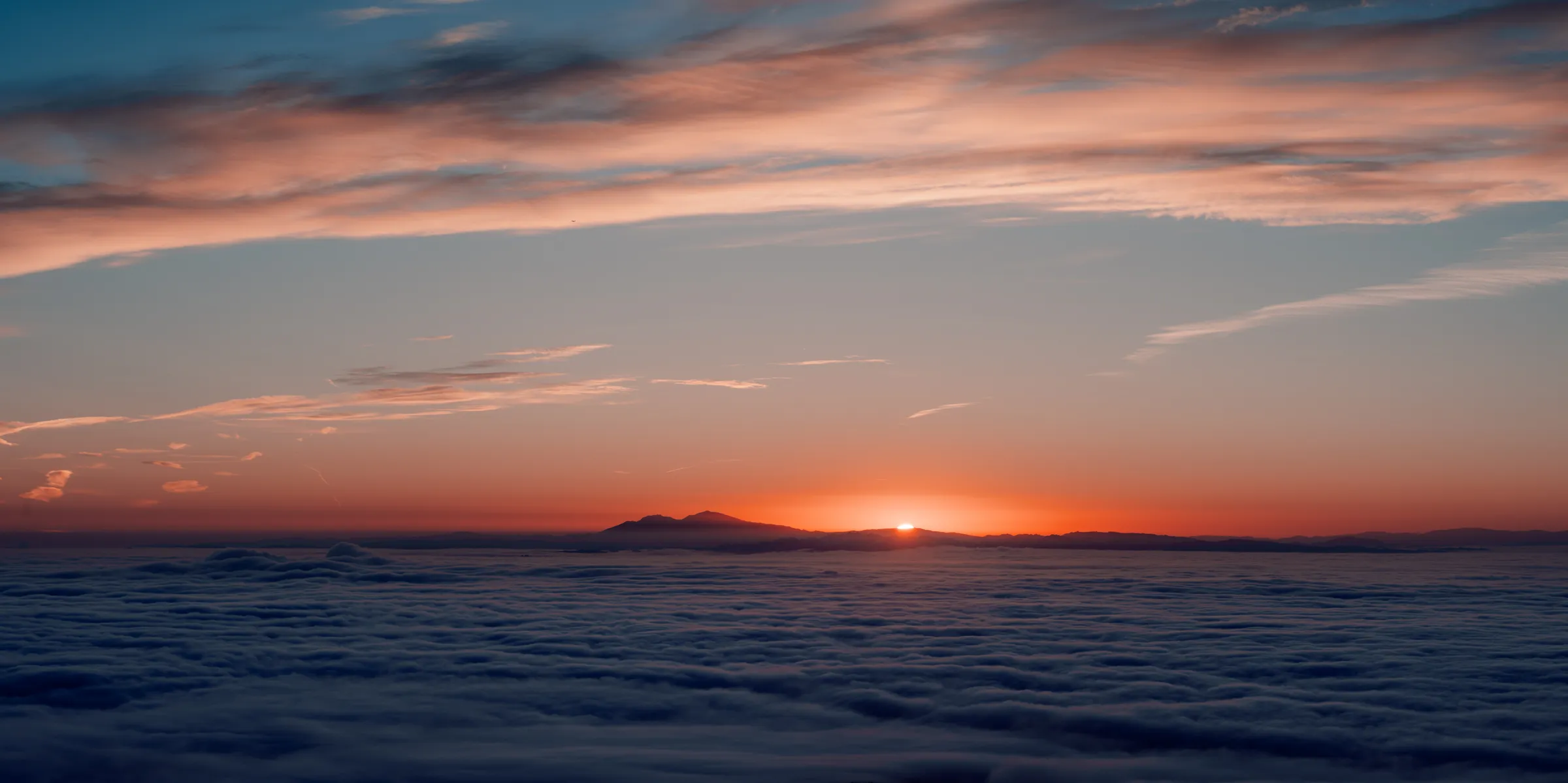 Sunrise over Mount Diablo above a sea of fog, landscape photography by Will Van Eaton